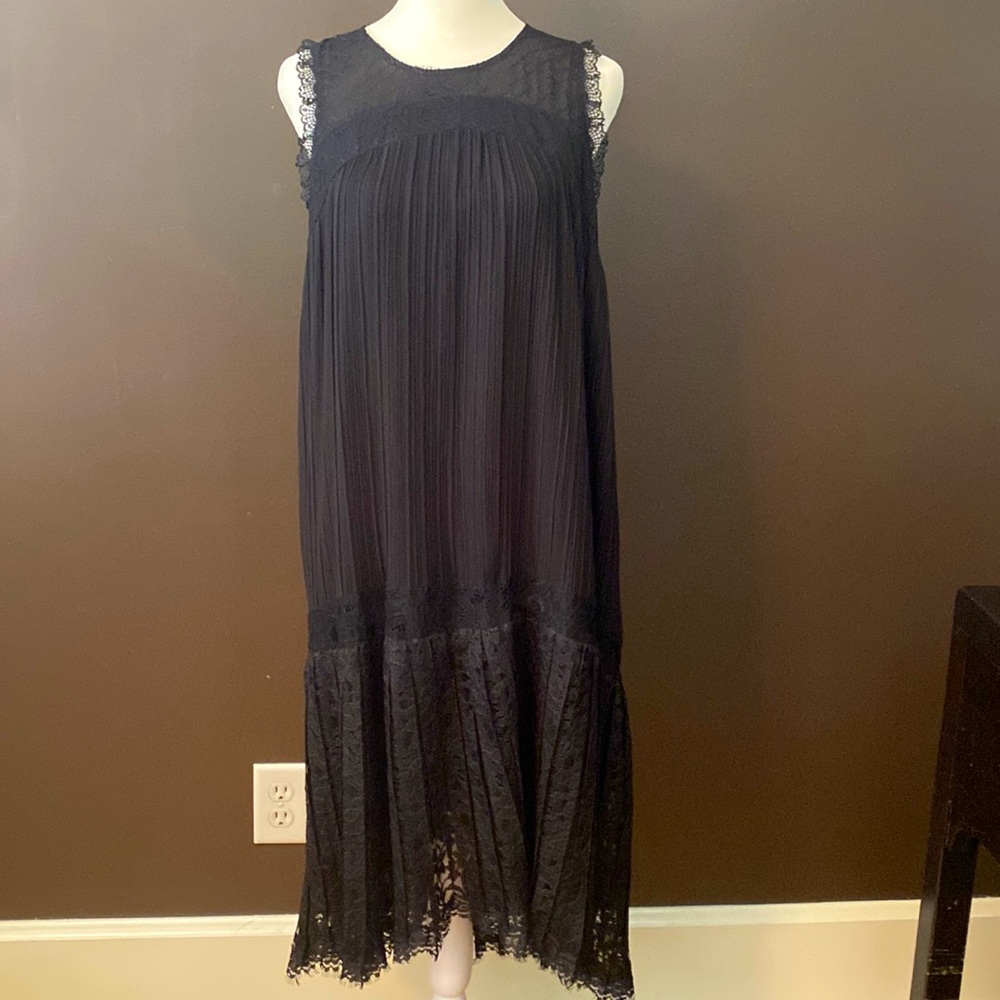 Floreat black pleated dress with beautiful lace details.